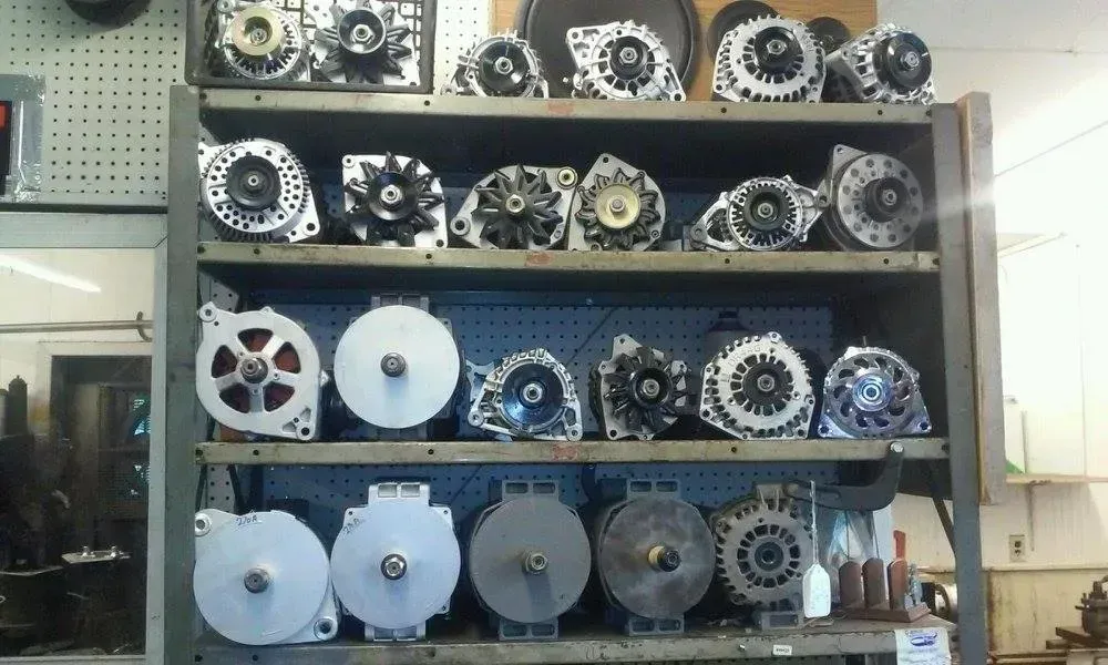 Shelves of mechanical gears and pulleys displayed in a workshop or lab setting
