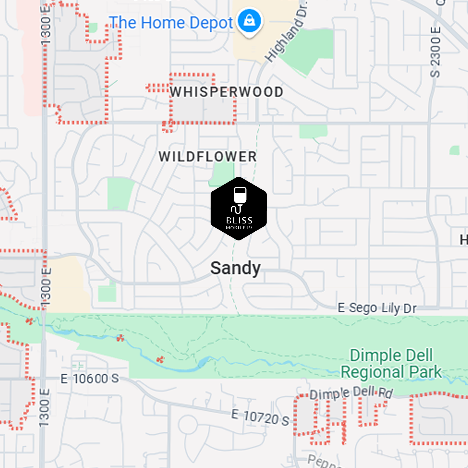 Map of Sandy, Utah, with a black real-estate marker near Whisperswood and Wildflower, close to The Home Depot.