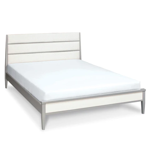 A bed with a white mattress and a white headboard on a white background.