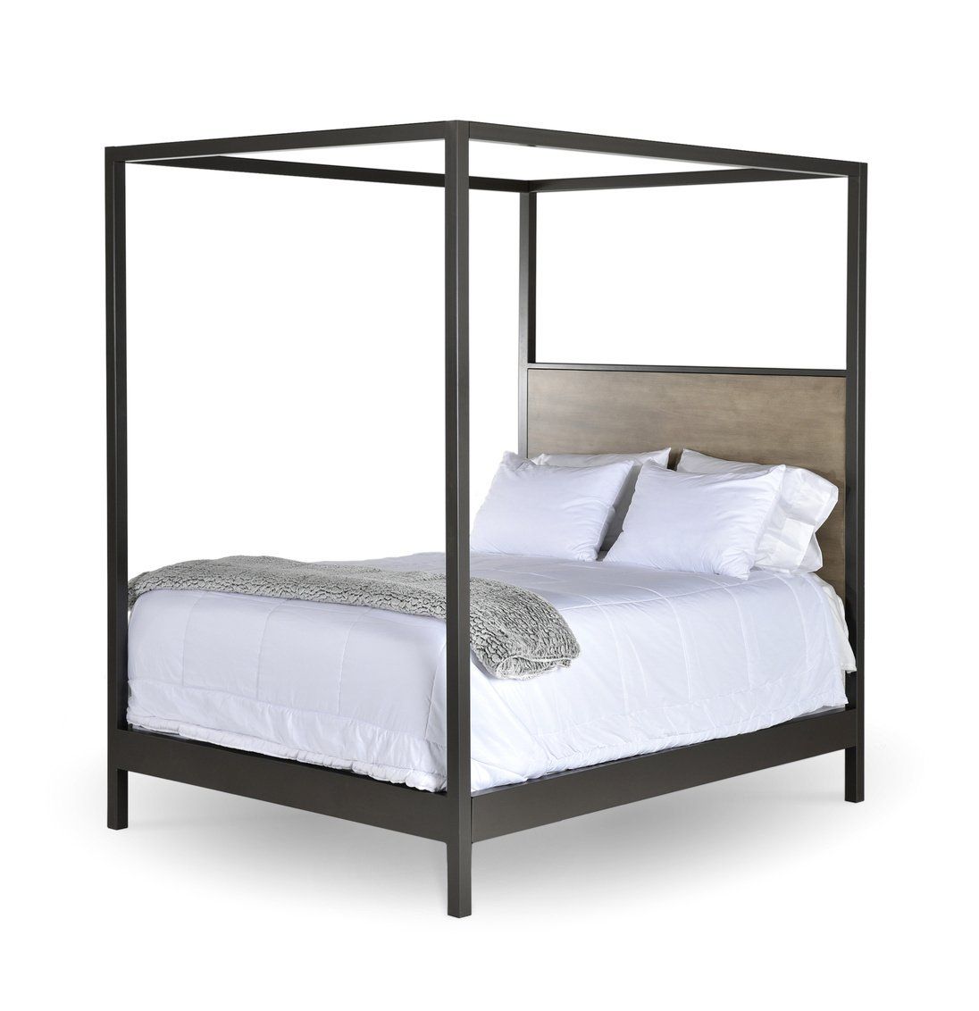 A canopy bed with white sheets and pillows on a white background.