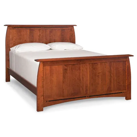 A wooden bed with white sheets and pillows on a white background.