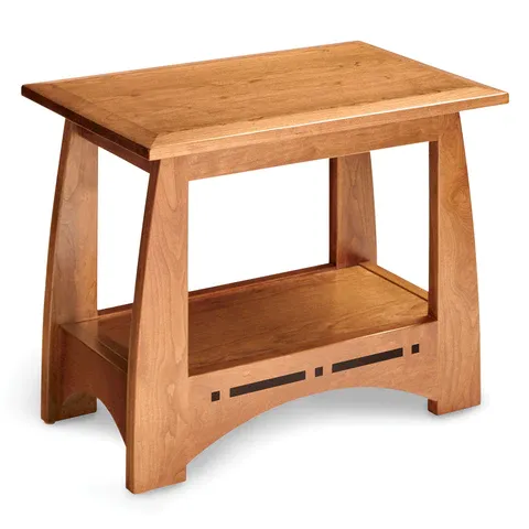 A small wooden table with a shelf underneath it