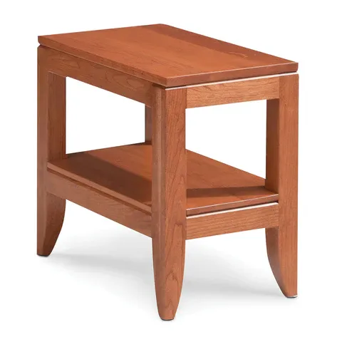 A small wooden table with a shelf underneath it