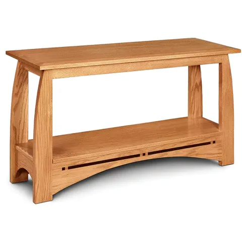 A wooden table with a shelf underneath it on a white background