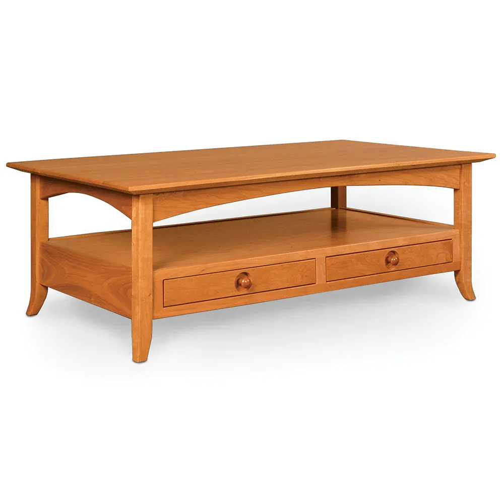 A wooden coffee table with two drawers and a shelf on a white background.