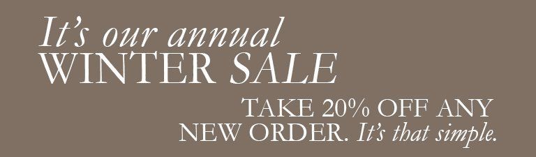 A sign that says it 's our annual winter sale take 20 % off any new order