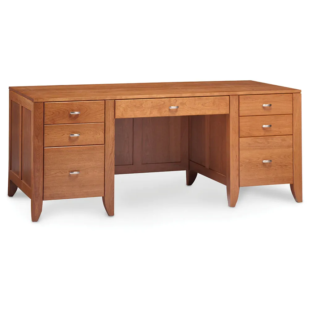 A wooden desk with drawers on a white background.
