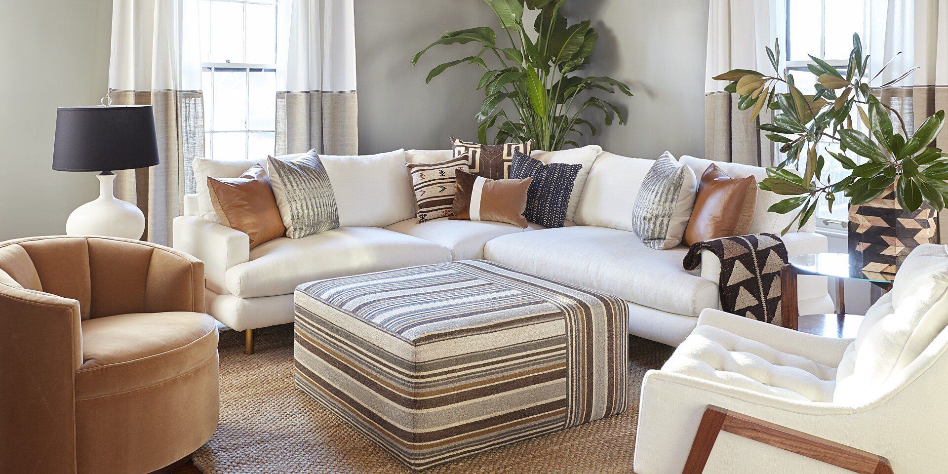 A living room filled with furniture and a large sectional couch.