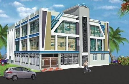a car is parked in front of a large building .