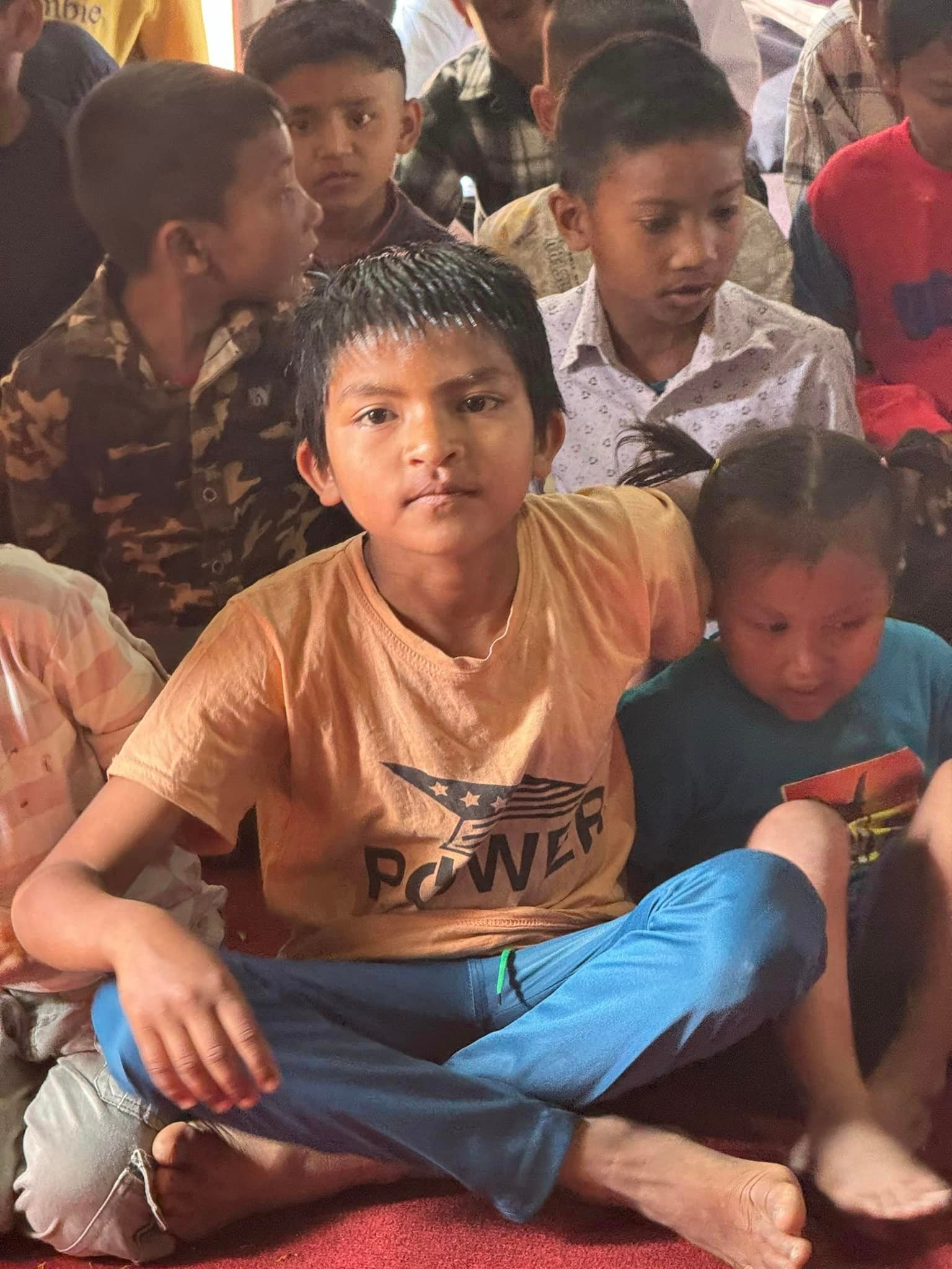young boys grouped together to get their picture taien at the Mission in India