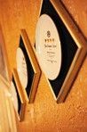 A row of picture frames hanging on a wall.