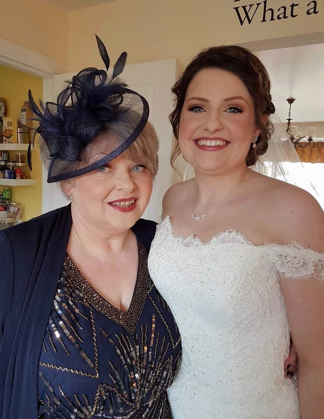 Happy bride and guest posing for camera