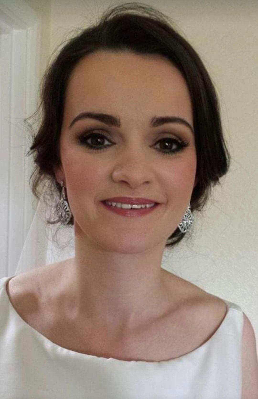 Brown haired bride looking at camera