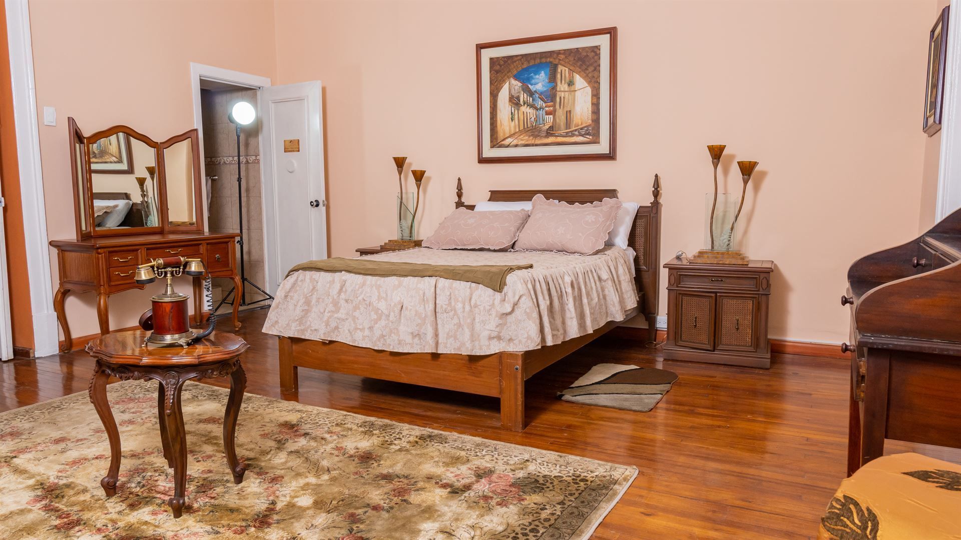 There is a large bed in the middle of the room.
