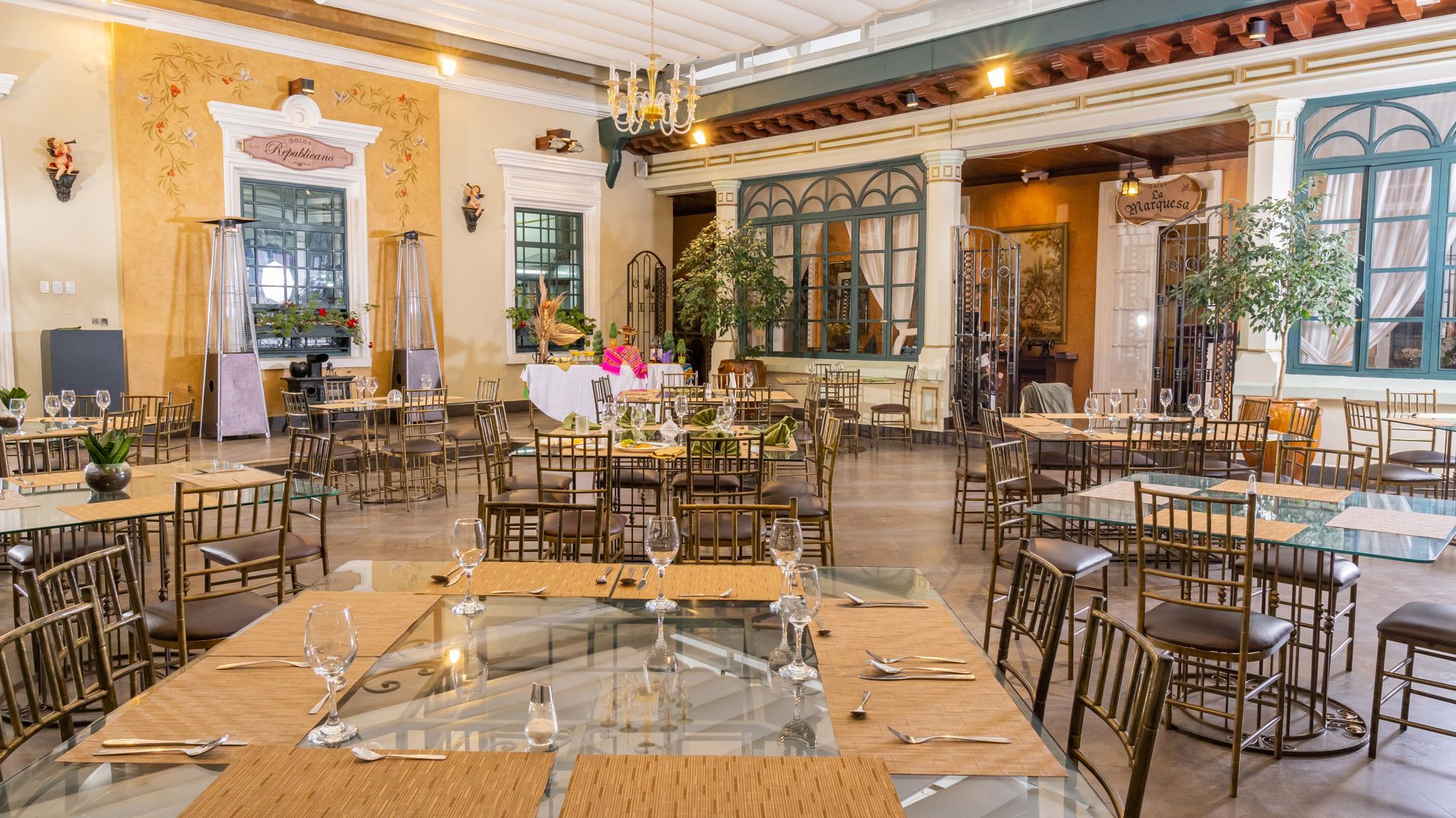 There are many tables and chairs in the restaurant.