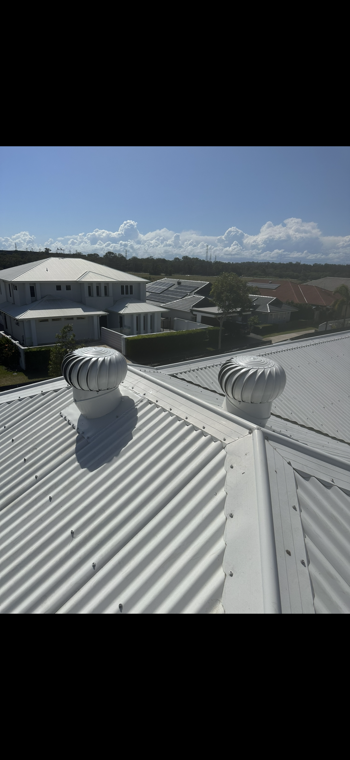 Two Whirly Bird at the top of metal roof — Whirly Bird King in Buderim, QLD