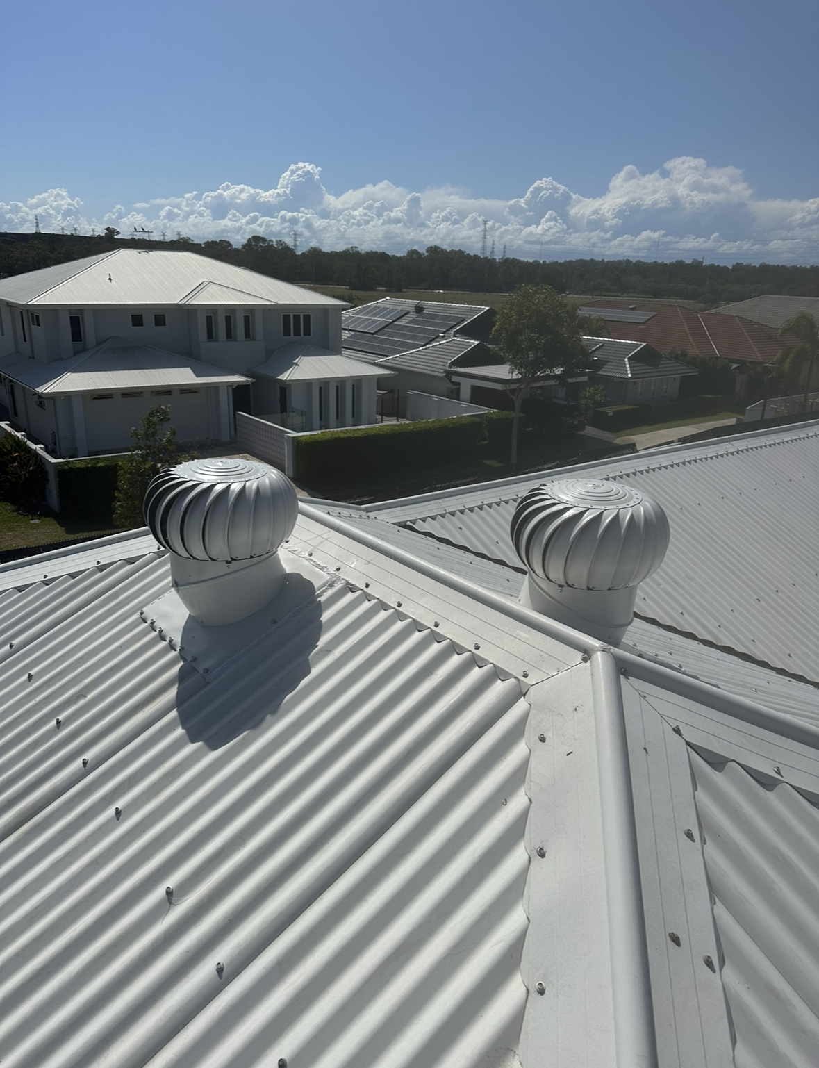 Newly Installed Two Whirly Birds On A Roof   — Whirly Bird King in Chermside, QLD