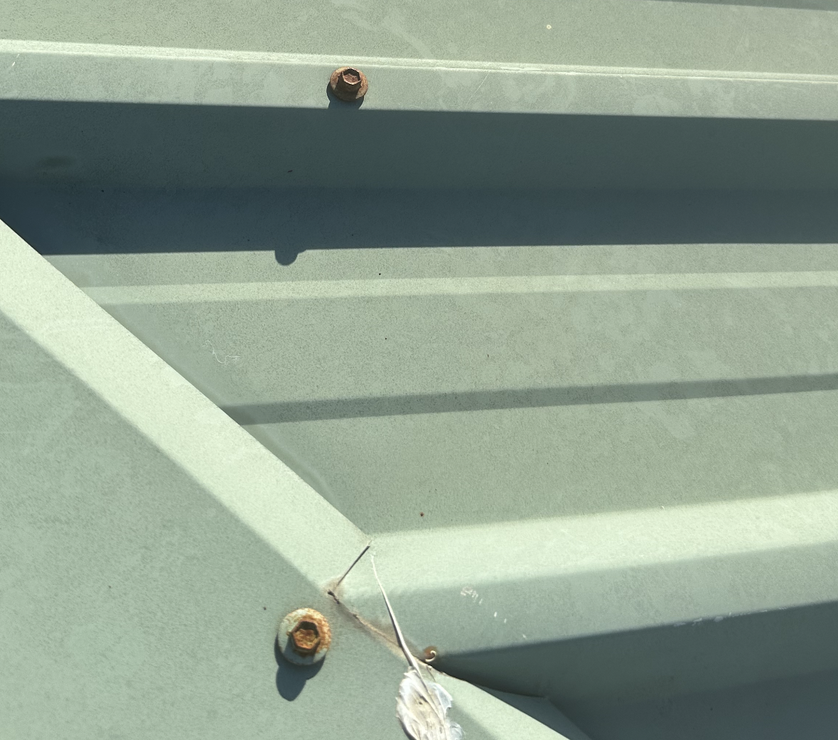Close-up of a Metal Roof Featuring Several Nuts — Whirly Bird King in Buderim, QLD