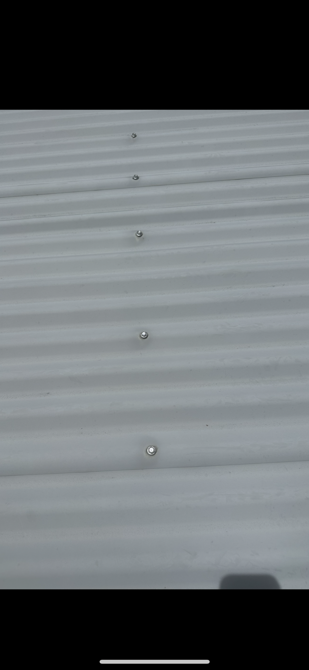 Close-up of a Corrugated Metal Roof, Showing a Line of Rivets — Whirly Bird King in Strathpine, QLD