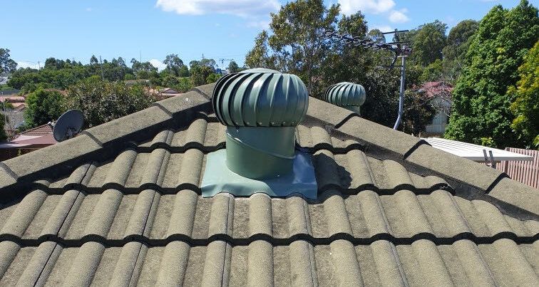Green Roof Vent on a Tile Roof, With Trees in the Background — Whirly Bird King in Buderim, QLD