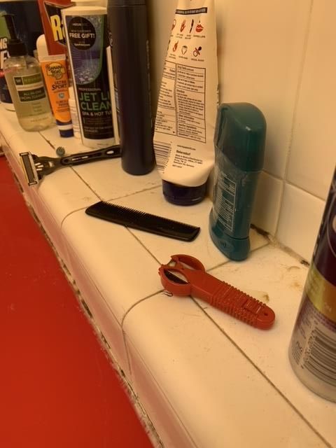 A row of shaving products including a razor and comb