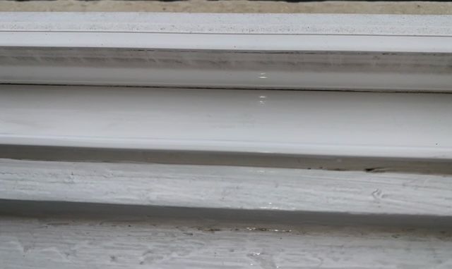 A close up of a white staircase with snow on it.
