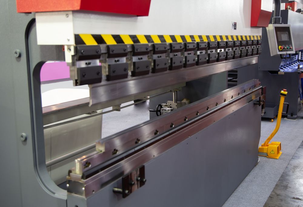 A Machine That Has a Yellow and Black Stripe on It — LM Engineering In Mareeba, QLD