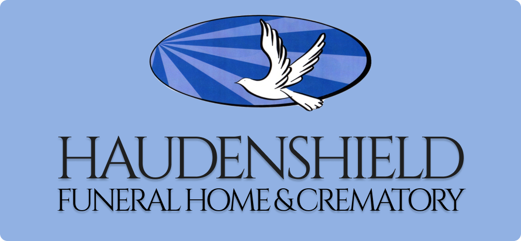 Haudenshield Funeral Home & Crematory logo with a white dove on a blue oval