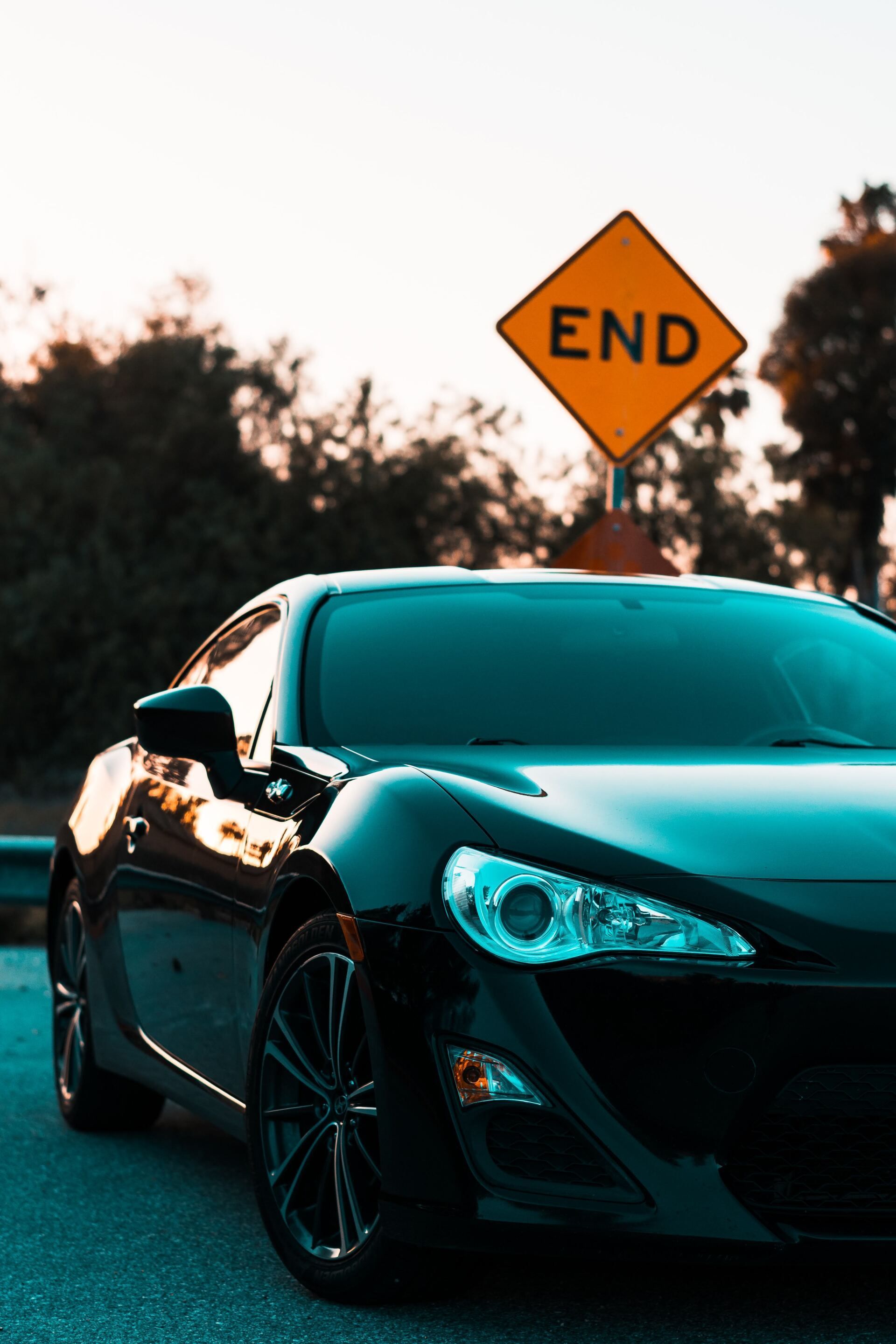 Black sports car parked next to