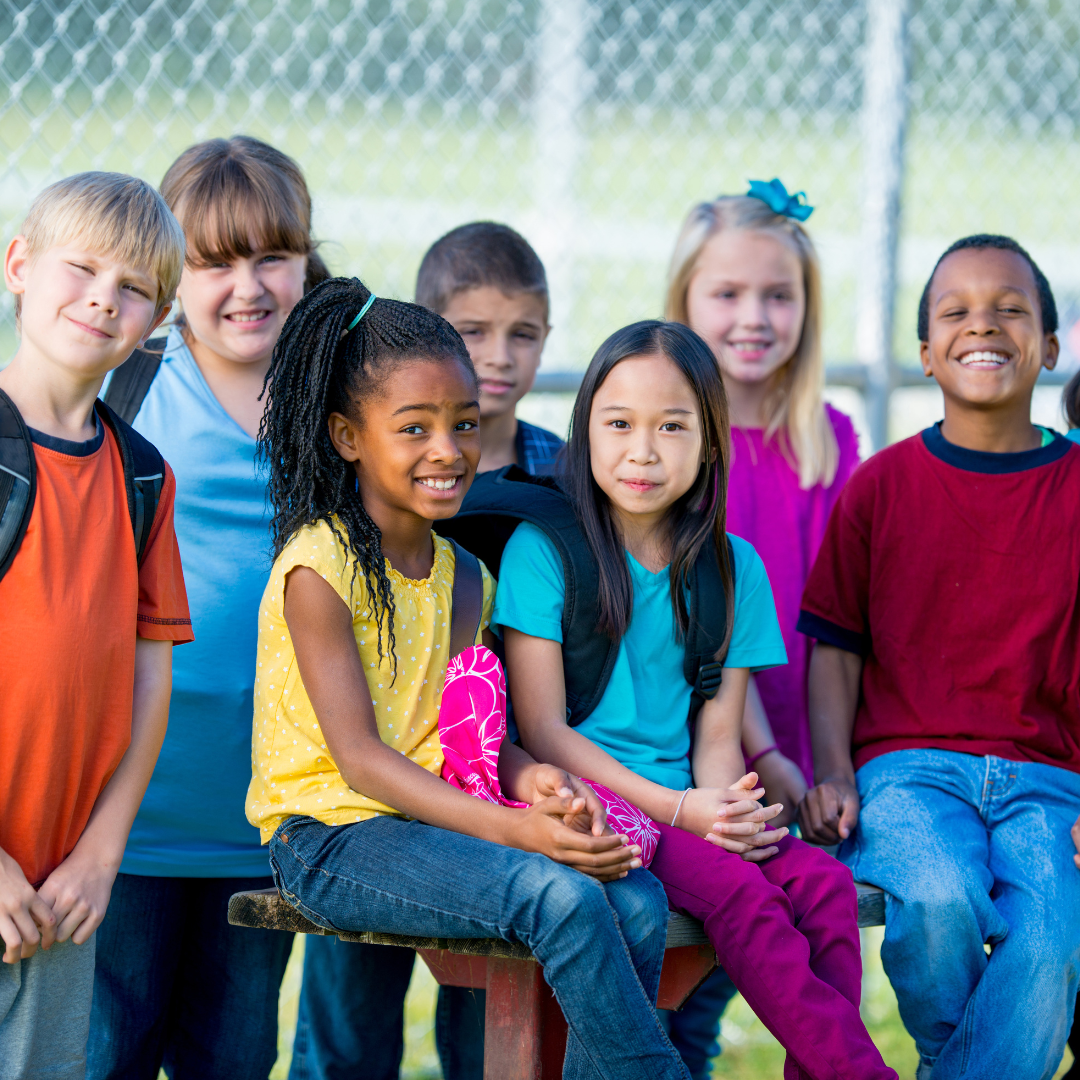 A group of children are posing for a picture together