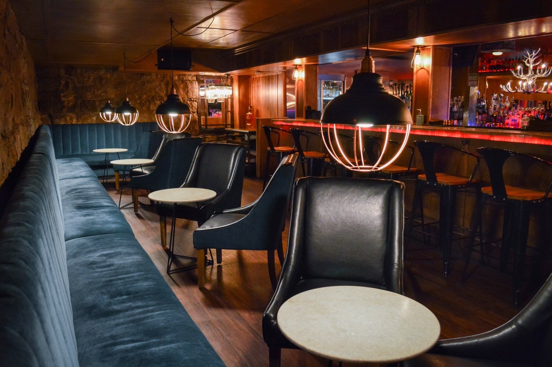 Bench seating by the bar in the lounge at Prescott cocktail and Bourbon bar