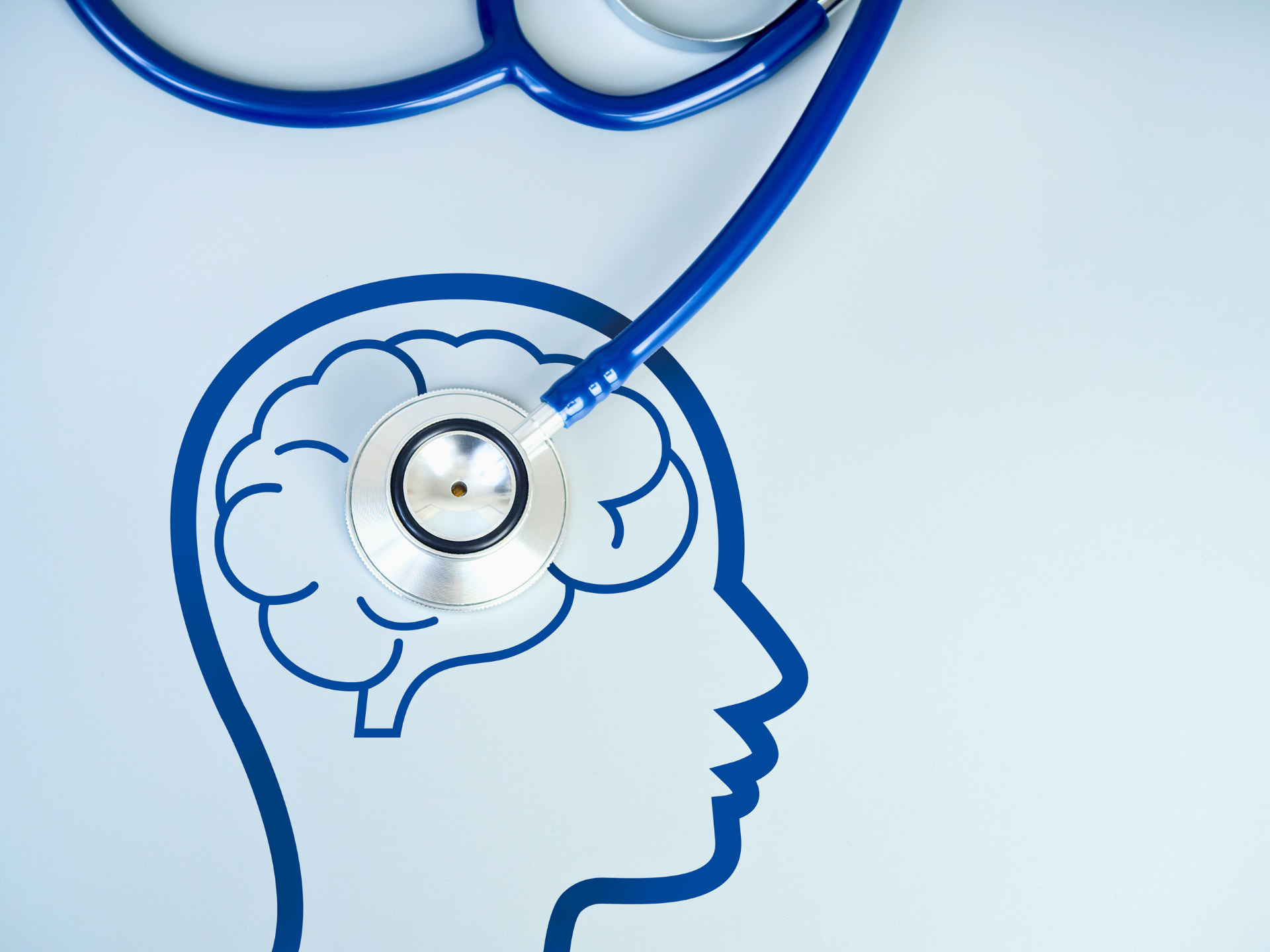 Blue line drawing of a head with a stethoscope examining the brain