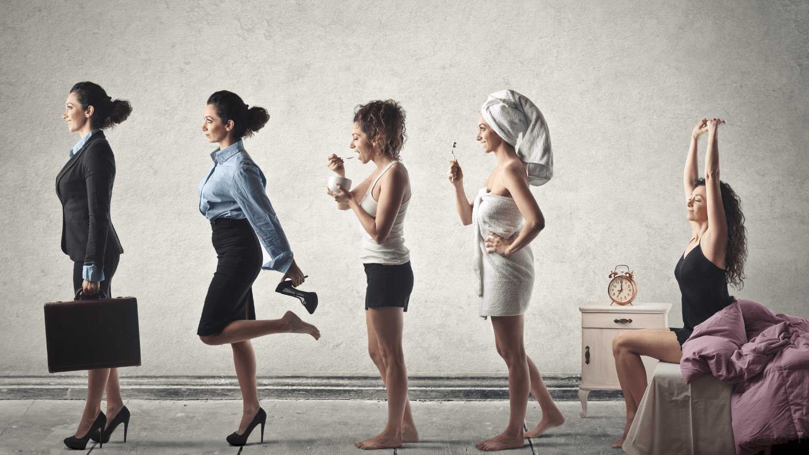 A group of women are standing next to each other in a row.