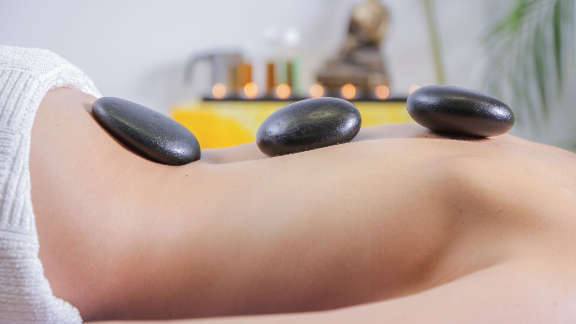 Hot stone massage for muscle tension and relaxation in Huntersville and Lake Norman, NC