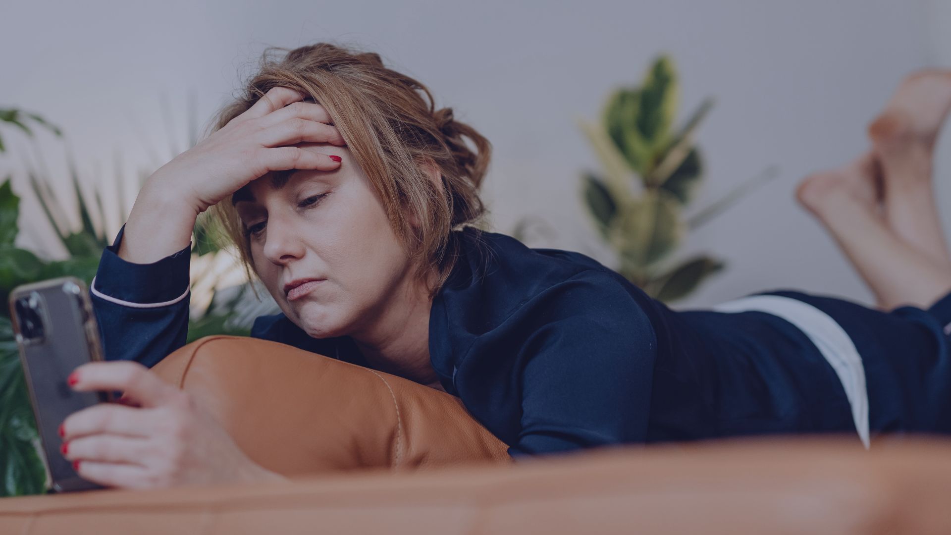 Stressed woman struggling to relax and unwind before booking massage therapy near Lake Norman, NC