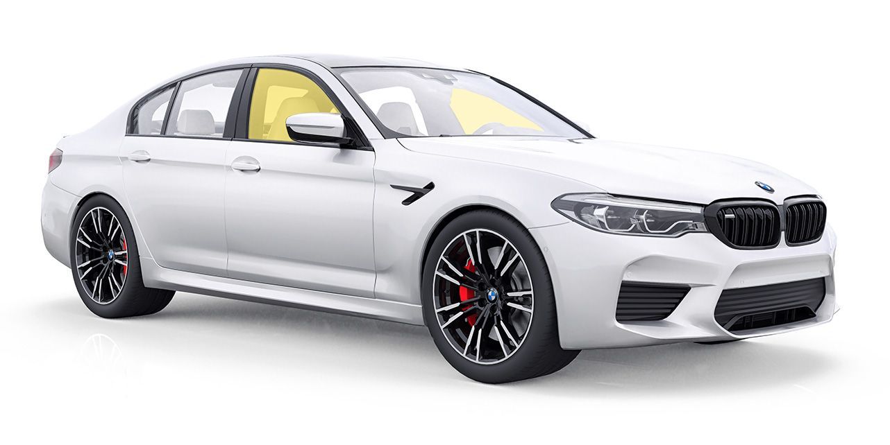 a white bmw with 2 front windows tint