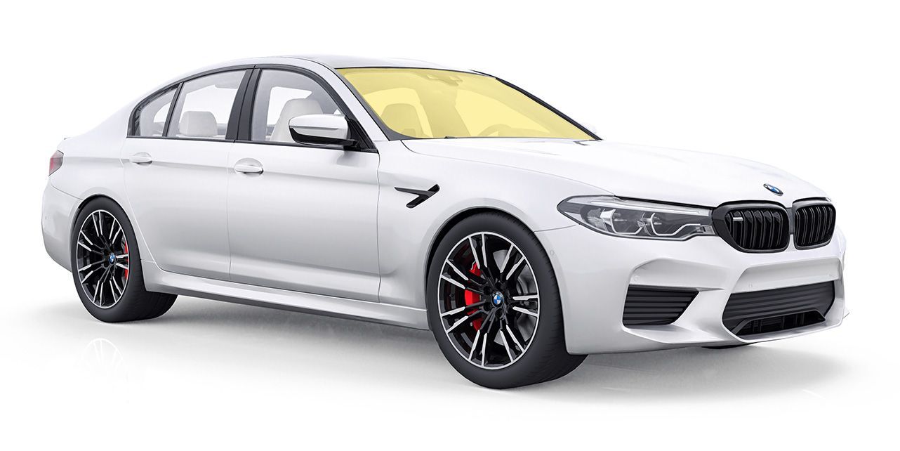 a white bmw with full windshield tint