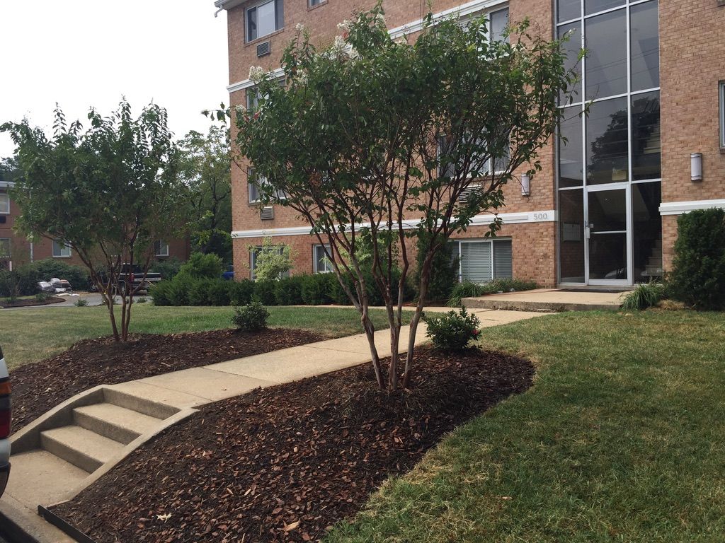 A brick building with a walkway leading to it