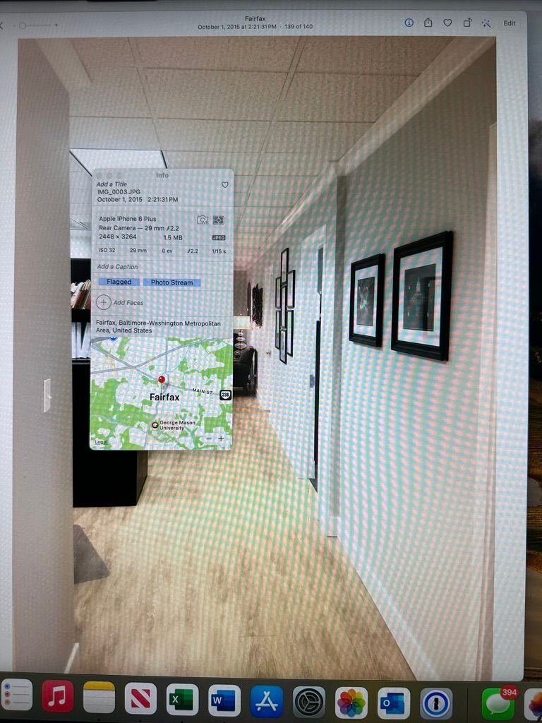 A computer screen shows a hallway with a map on the wall.