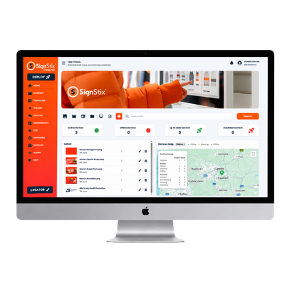 Desktop monitor with a bright orange screen on a white background