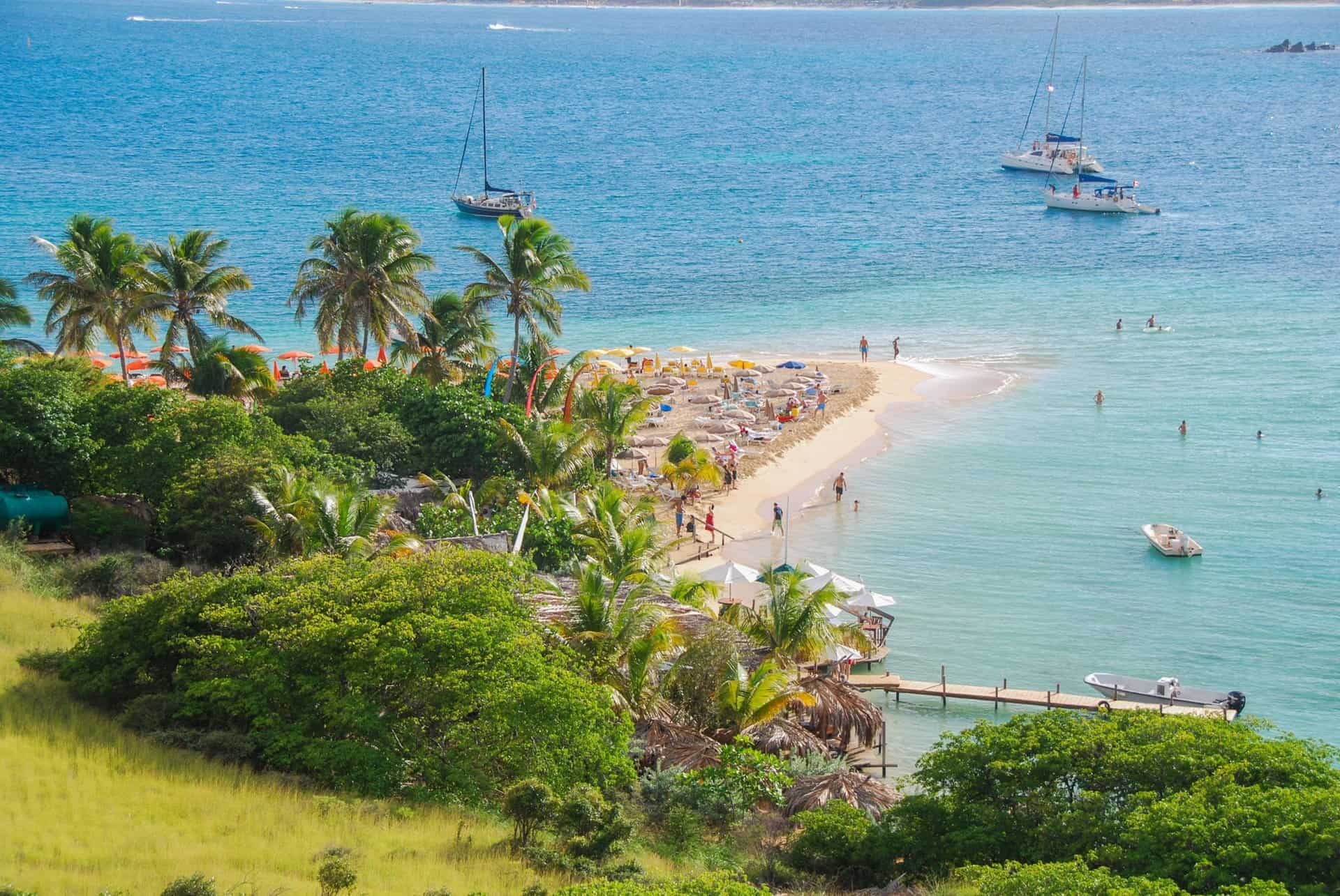 View of the main beach of Pinel island from above.