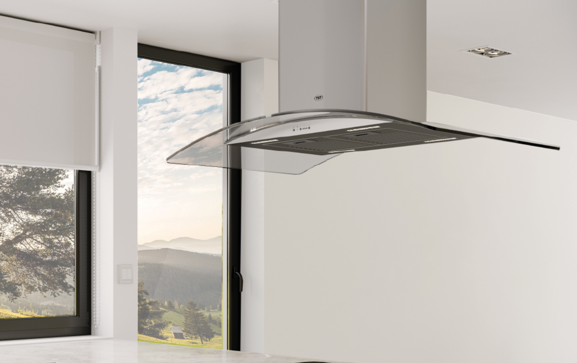 Cocina moderna con campana extractora de acero inoxidable y grandes ventanales con vistas a las montañas.