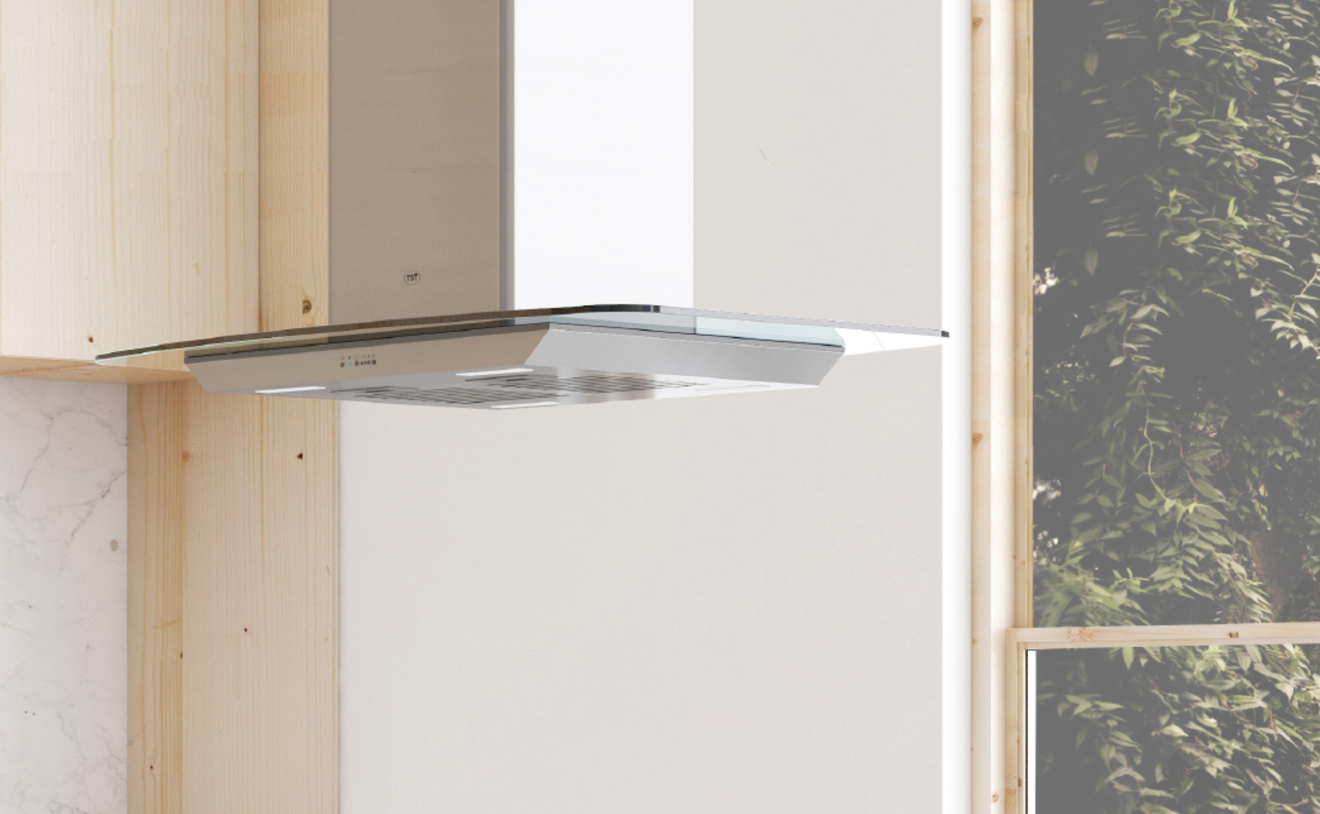 Campana extractora bajo armarios de cocina de madera clara, con una ventana al lado.