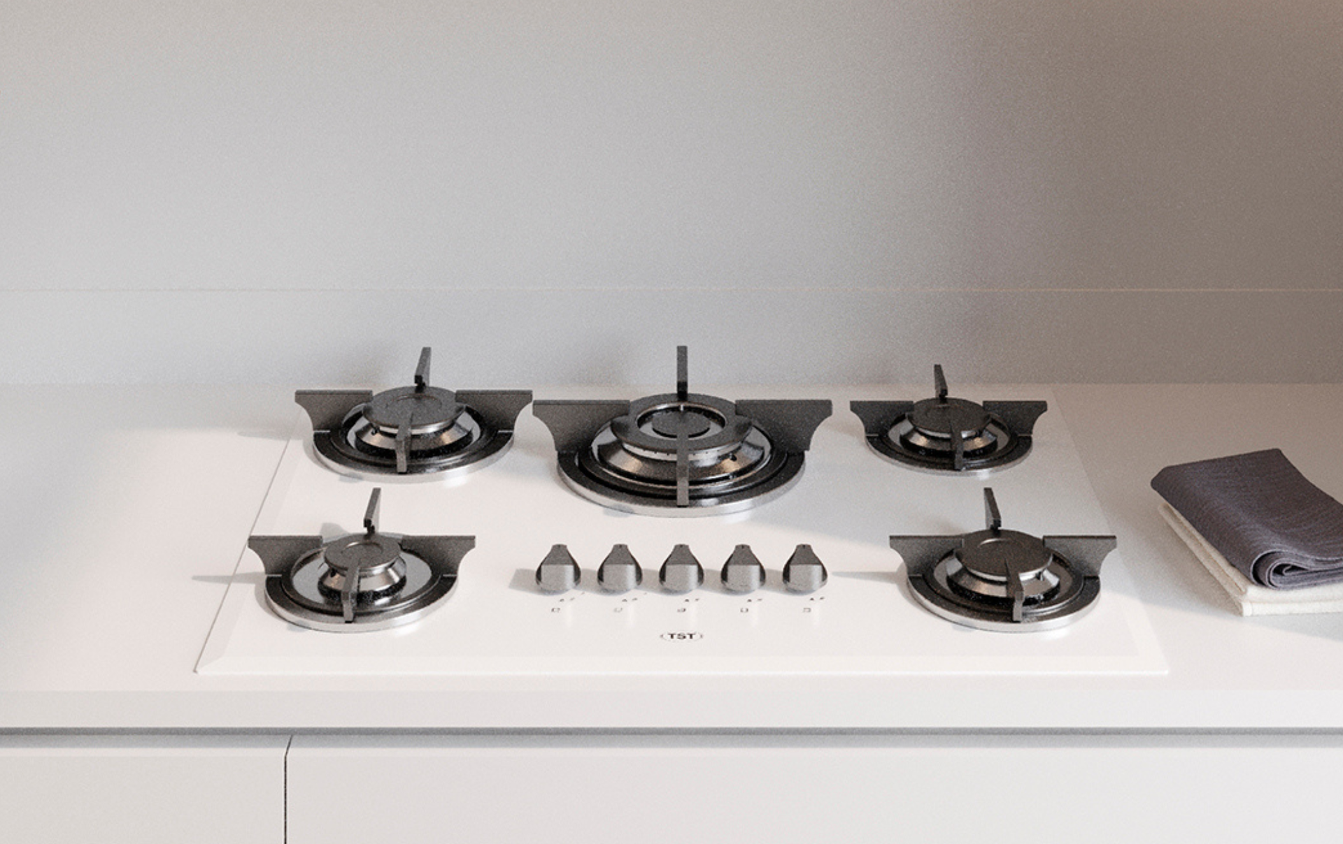 Encimera de cocina blanca con placa de gas de cinco quemadores y un pequeño electrodoméstico plateado a la derecha.