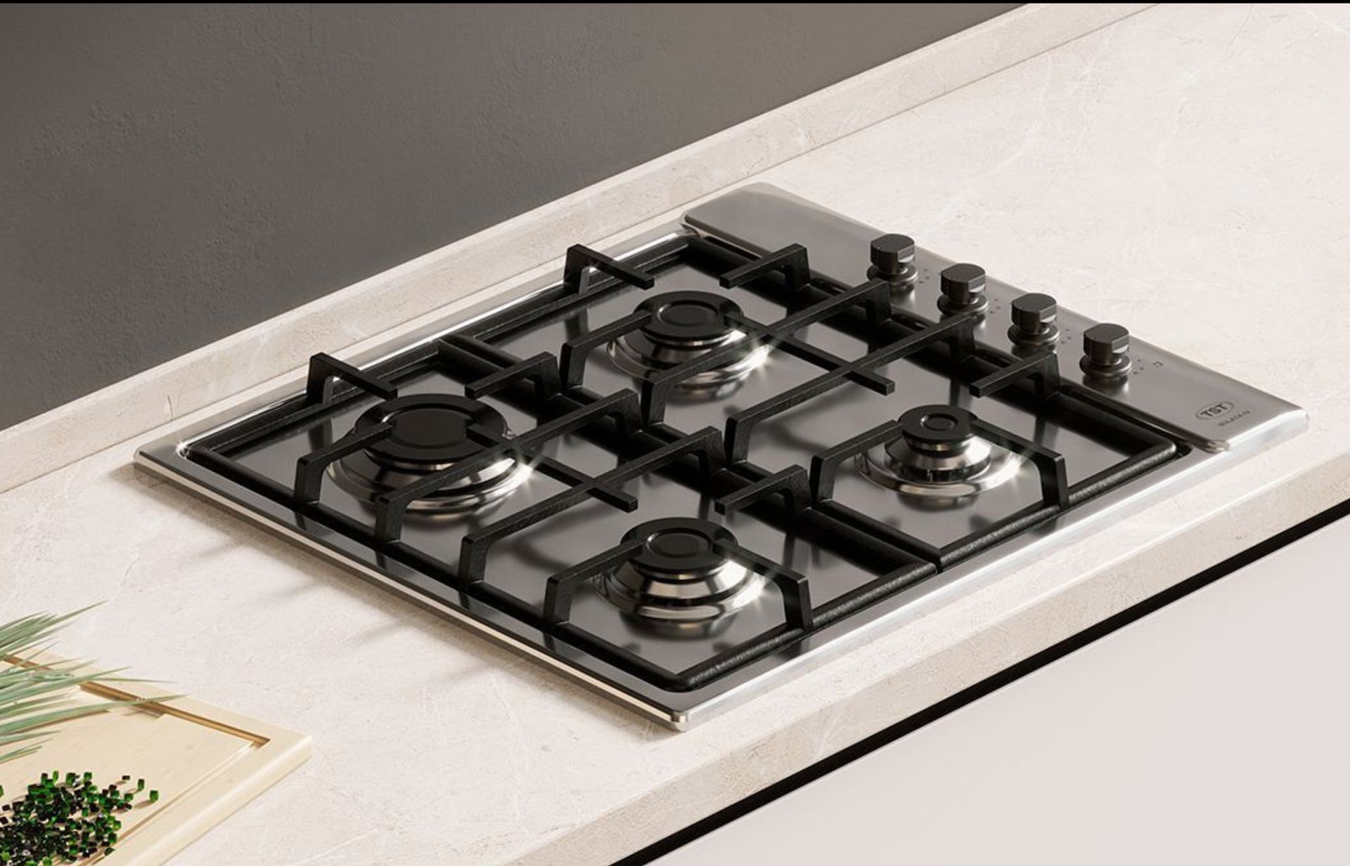 Placa de gas negra con cinco quemadores sobre una encimera de cocina clara.