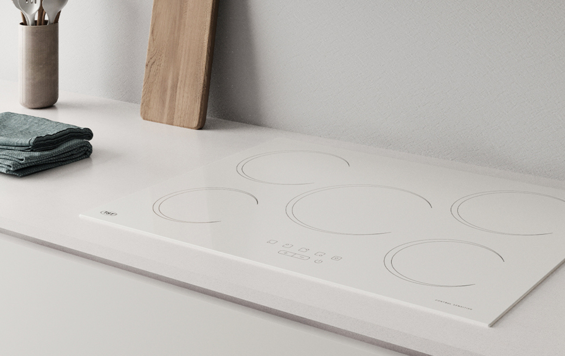Una placa de cocina blanca minimalista con tenues contornos circulares de quemadores y un paño oscuro doblado cerca.
