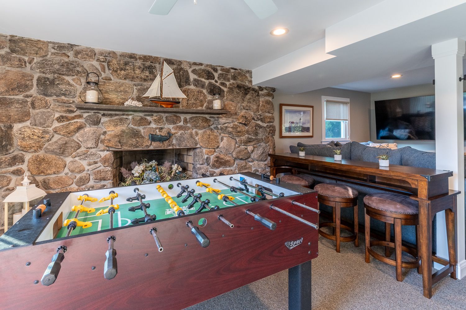 There is a foosball table in the middle of the room.