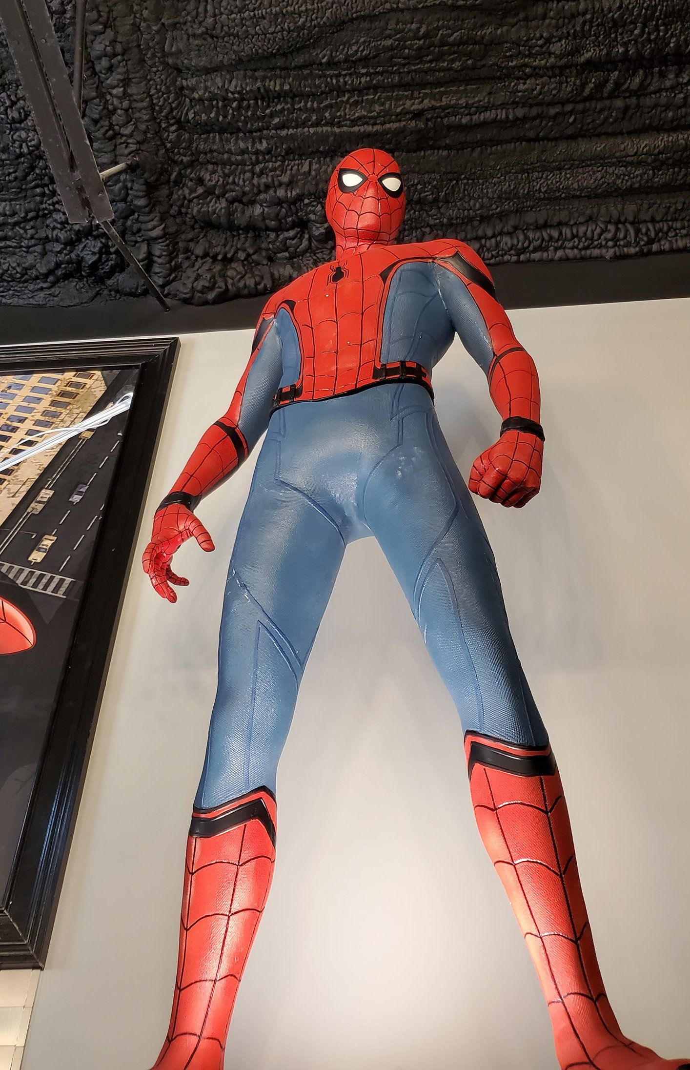 Spider-Man figure in red and blue suit standing upright indoors
