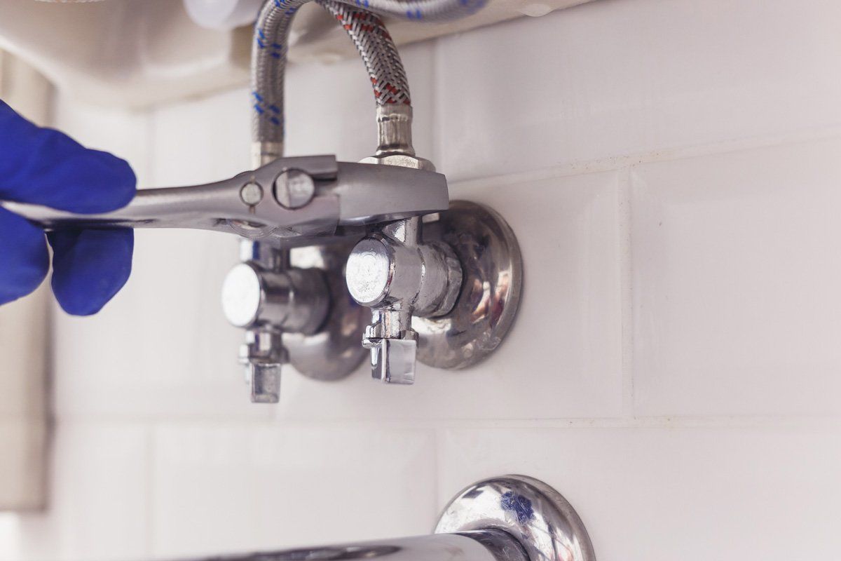 Installing faucet — Corsicana, TX — AKV Plumbing Co