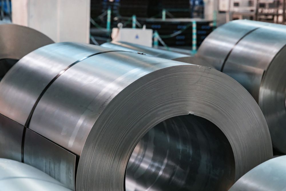 A Bunch of Metal Rolls Are Stacked on Top of Each Other in A Factory — Betts Welding Pty Ltd In Moss Vale, NSW